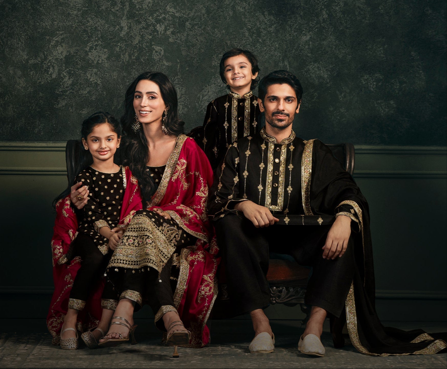 Family in matching traditional Indian attire