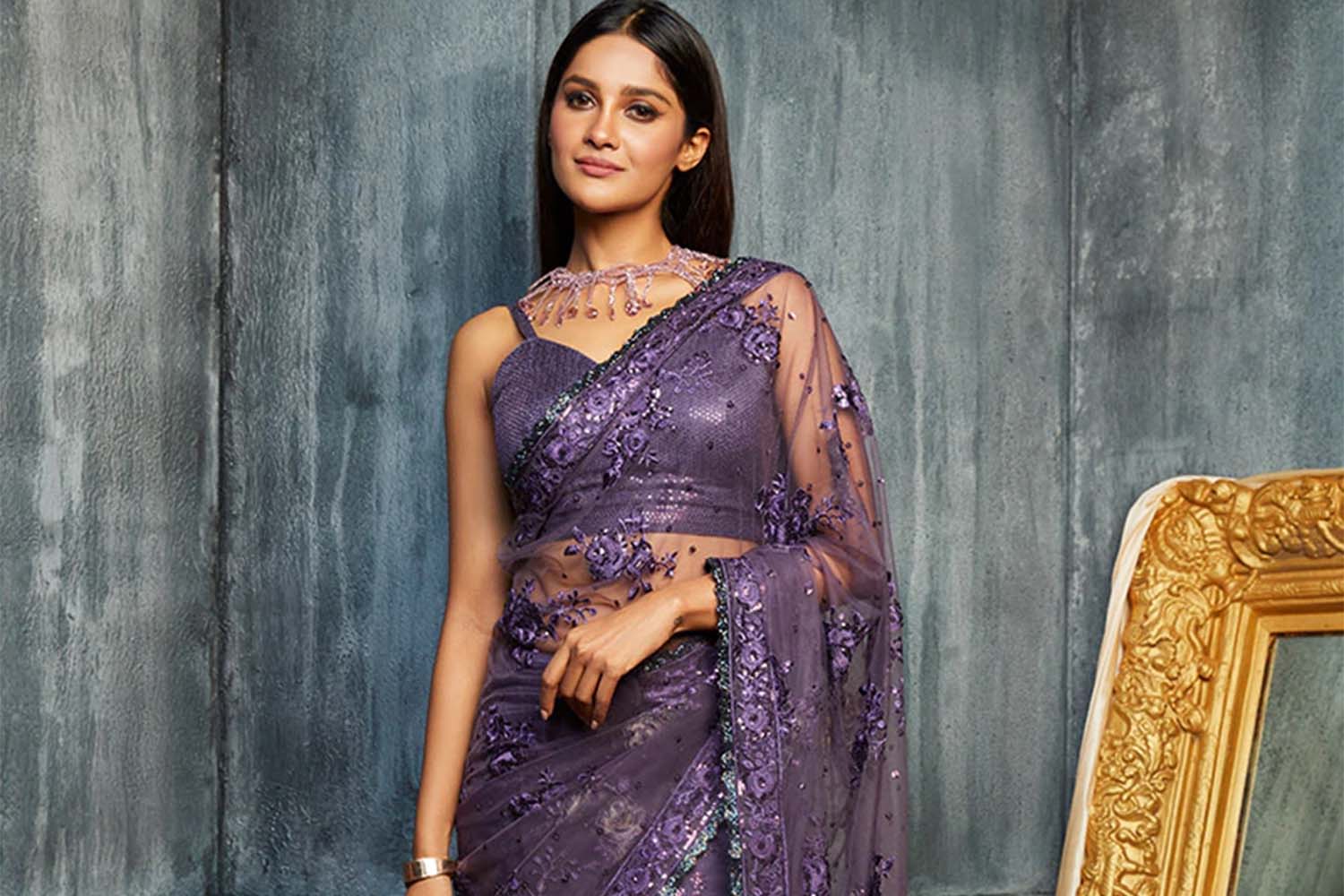 Woman wearing a purple embellished saree