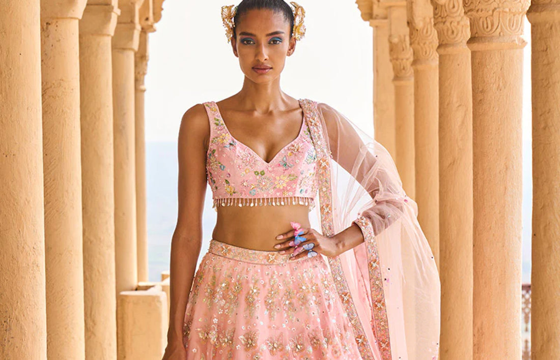 https://www.lashkaraa.com/products/peach-heavy-embellished-net-lehenga