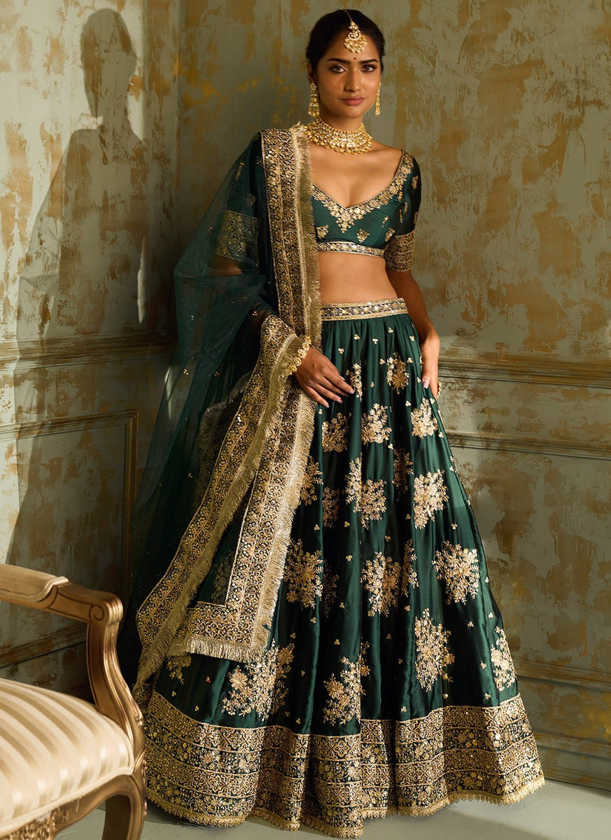 dark green indian wedding dress Bride Chinju looking absolutely graceful in her customized dark green pure raw silk lehenga Designed with intricate fully hand-worked detailing on both the top and skirt, creating a rich and regal bridal