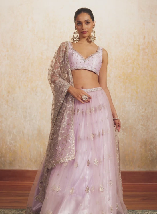 Lilac fish cut lehenga with heavy hand embroidered designer jacket and frill dupatta